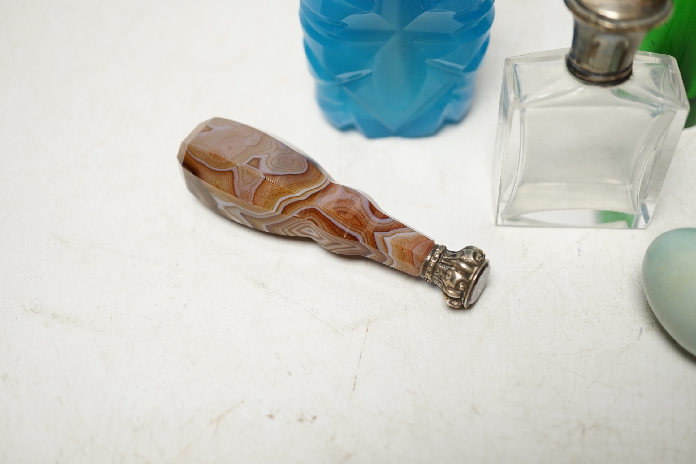 Five assorted mounted scent bottles including glass and ceramic egg shape, largest 94mm, together with a Victorian banded agate handled white metal desk seal. Condition - poor to fair